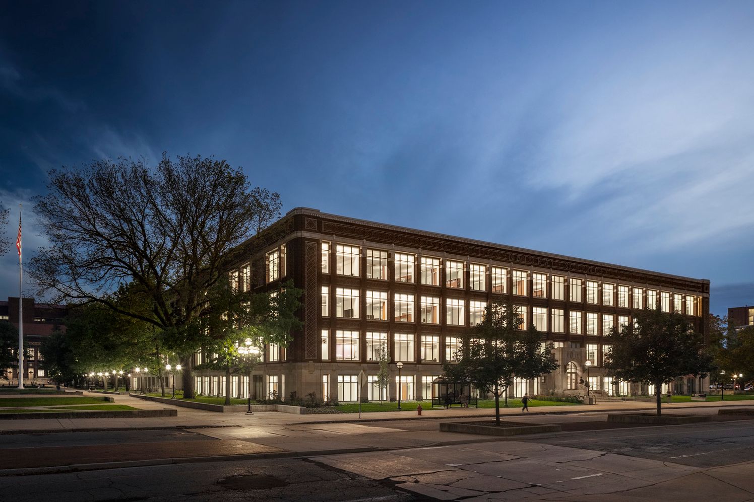 Exterior photos of University of Michigan's Kinesiology Building at night