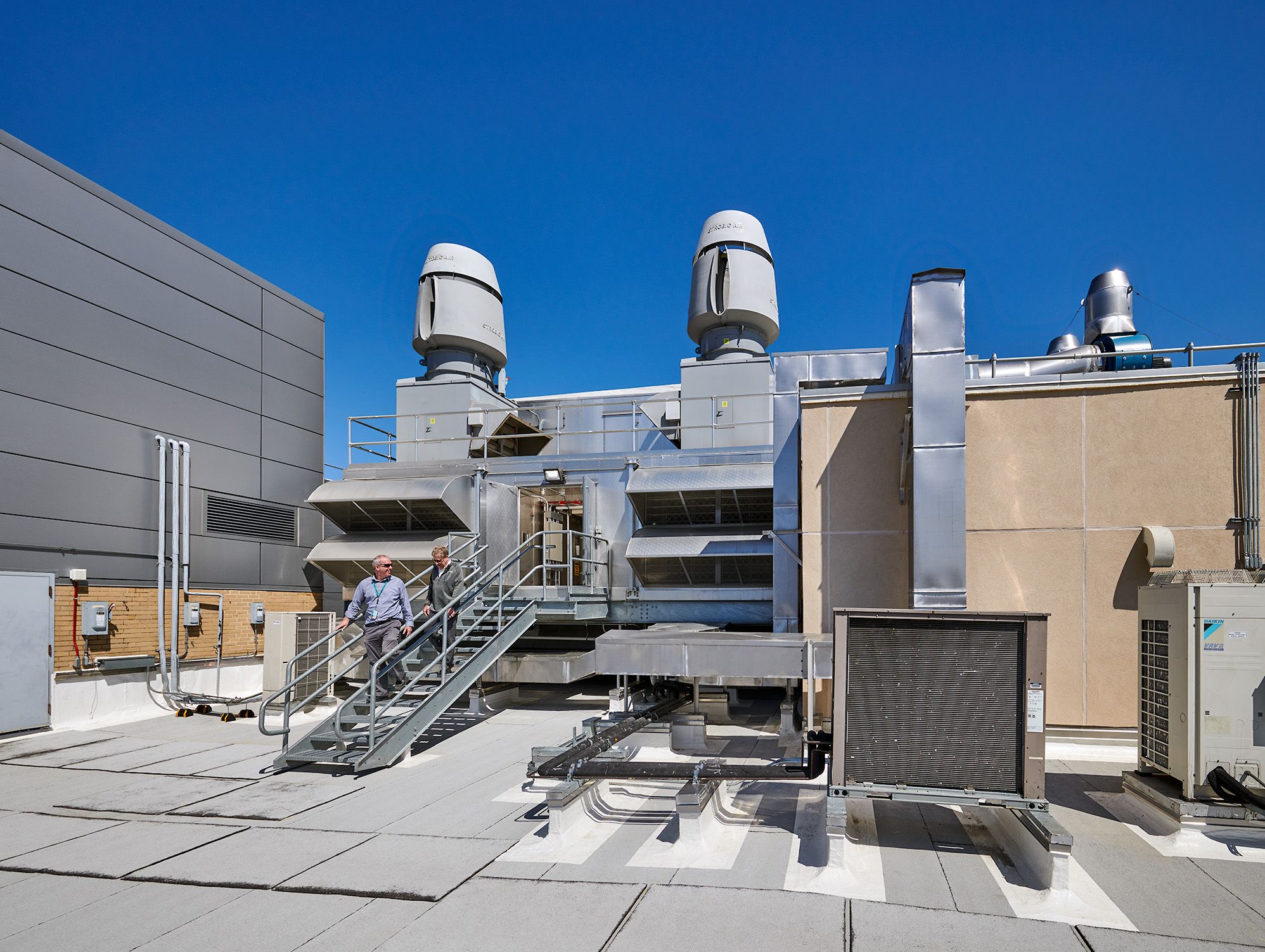 view of Bloomberg School of Public Health roof with people coming downstairs